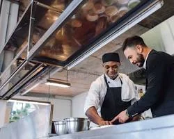 A waiter serving guests